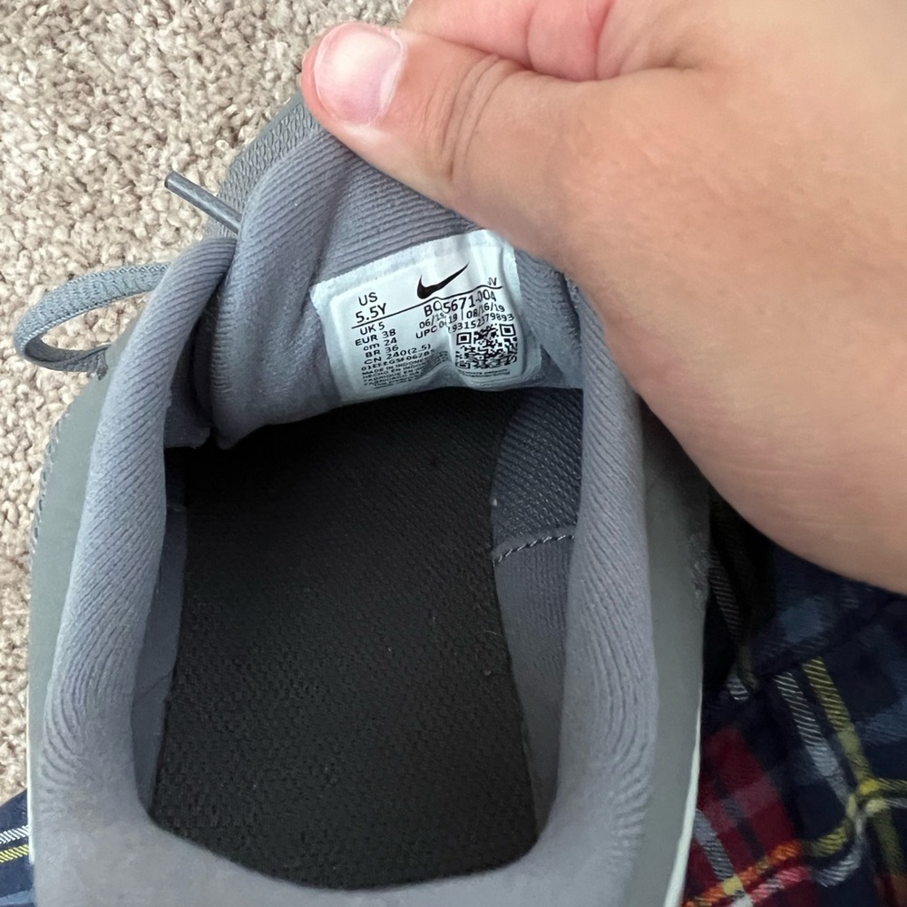 Nike grey running shoes.